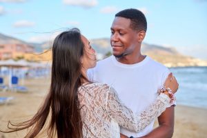 Beautiful young couple in love on the beach